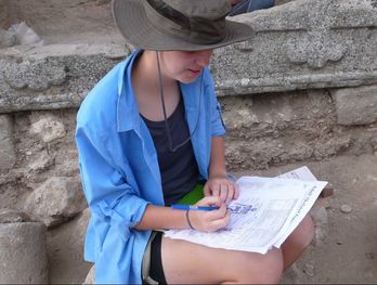 Student taking notes at the Zorita cemetery